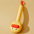 Small yellow duck-shaped pet comb with open needle design for cat and dog grooming