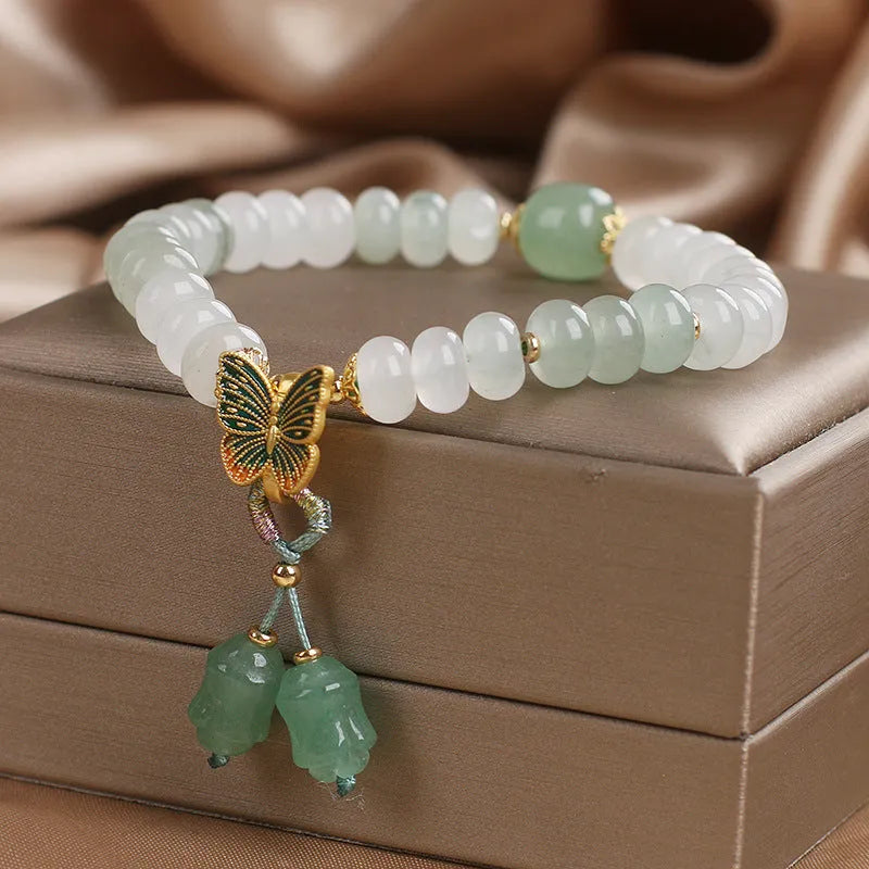 Green Tian Shan Cui abacus bead bracelet with crystal construction and butterfly tassel charms