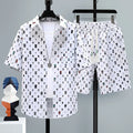 Men's casual sports shorts two-piece set in polyester, showing short sleeve top and matching shorts.