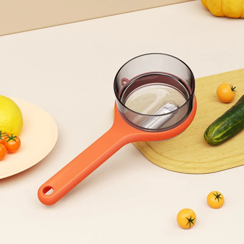 Kitchen storage peeler with integrated bucket in light green or orange colour
