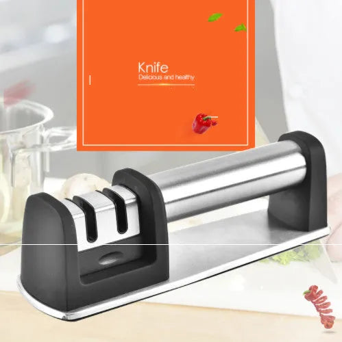 Black multi-purpose kitchen sharpener with stainless steel holes for knives, scissors, and screwdrivers on a non-slip ABS plastic body.