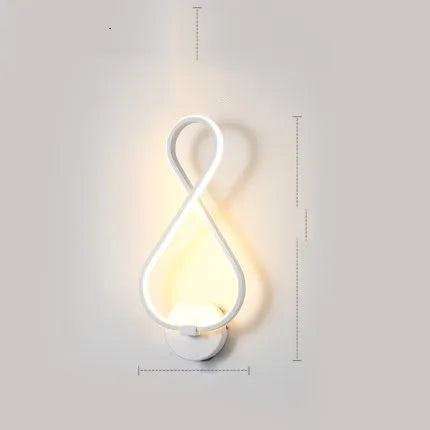 Nordic minimalist LED wall lamp with silicone shade in black finish on a white wall.