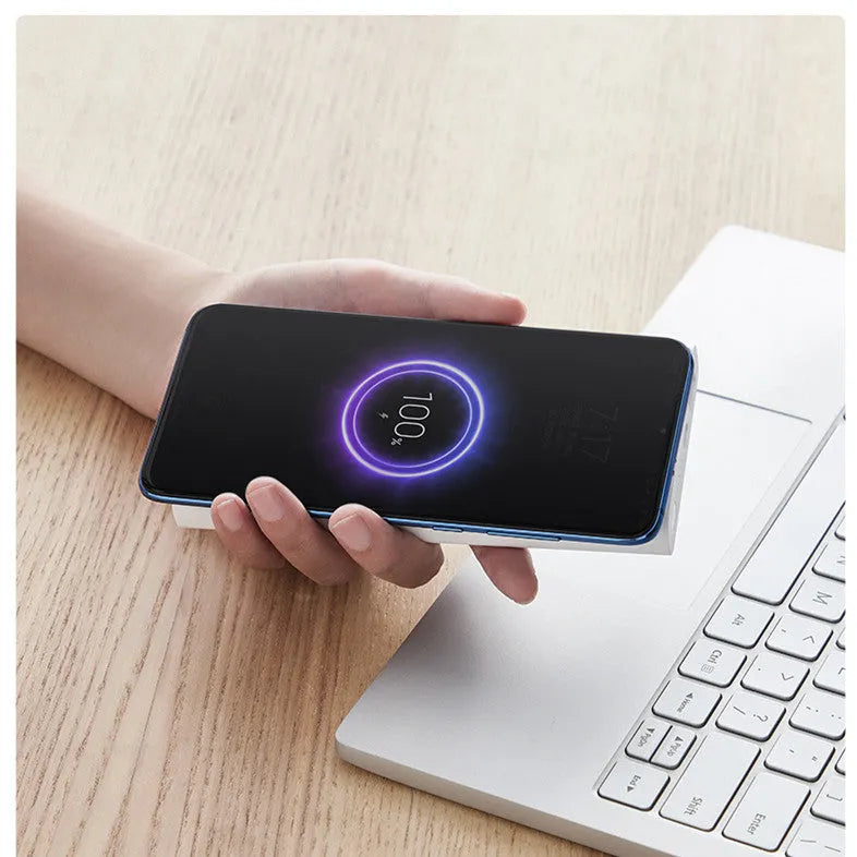 White or black 10000mAh capacity power bank showing USB-C port and wireless charging symbol