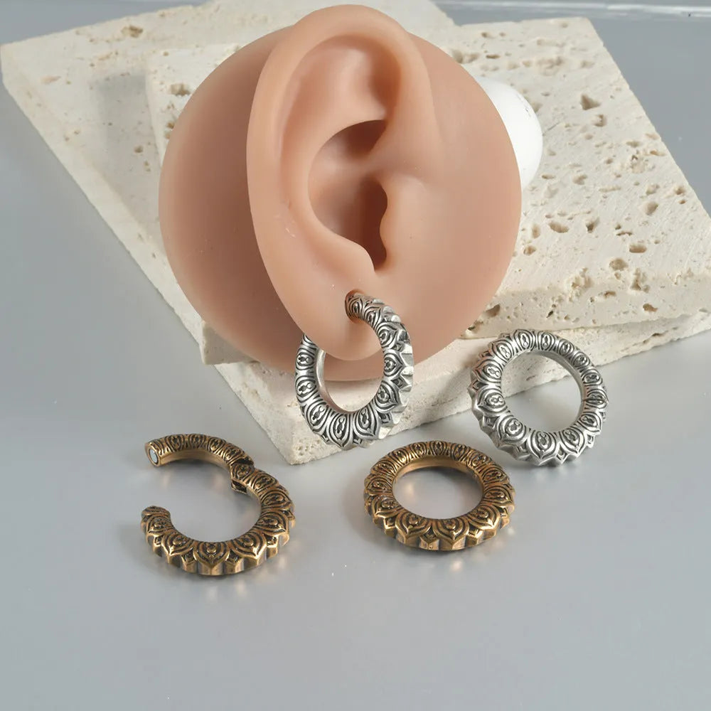 Retro geometric dragon silhouette earrings in antique silver, showing hollow-out design and large size.