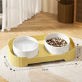 Green ceramic raised cat feeding bowls set with tilted design on a non-slip stand