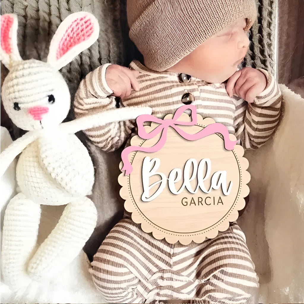 Square wooden baby room ornament with custom name engraving for nursery decor.