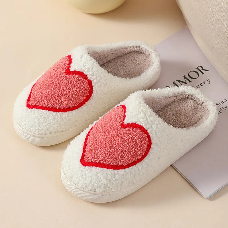 Women's plush round toe slippers with a PVC sole in Big Love colour.