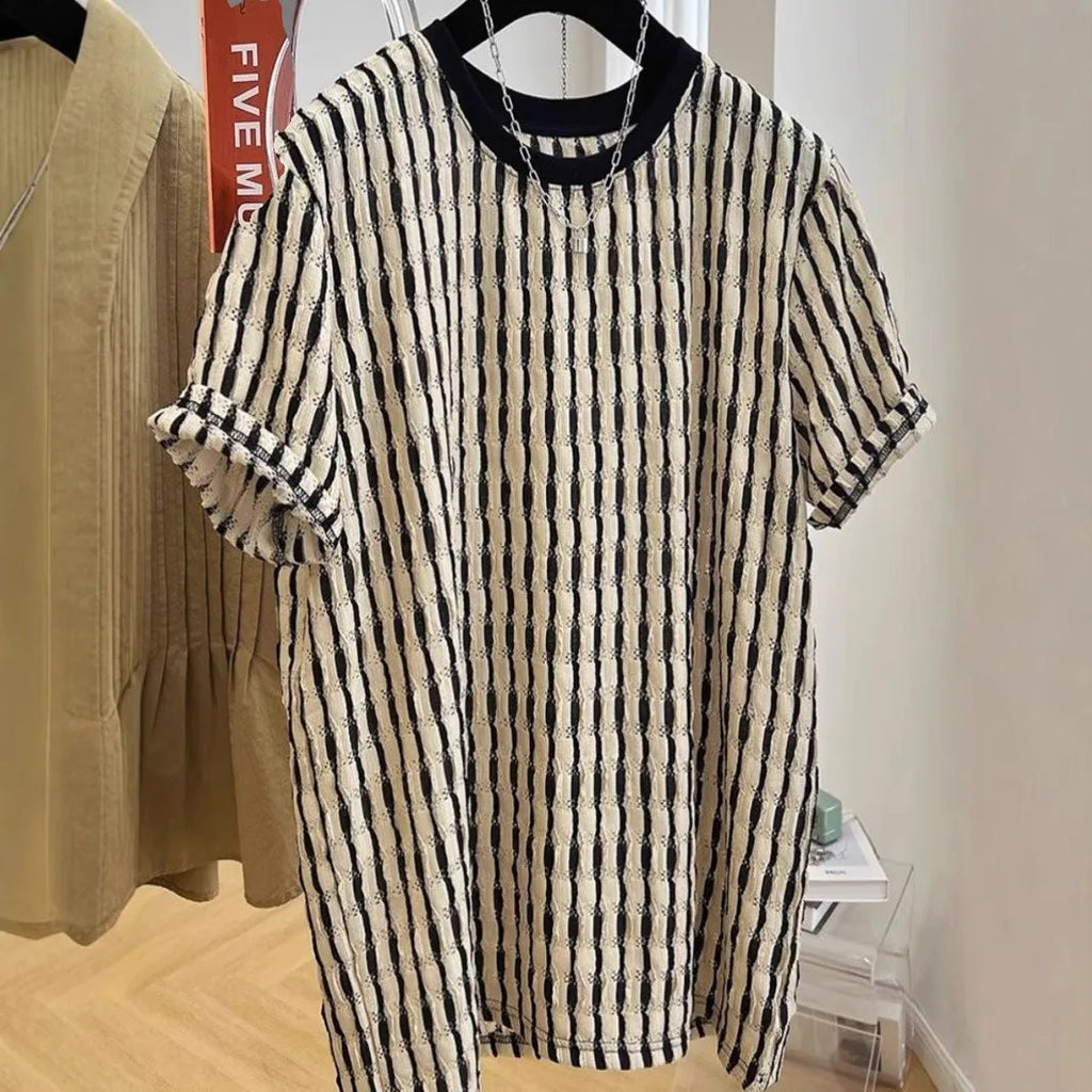 Men's black striped linen silk blend short sleeve shirt laid flat showing loose casual fit
