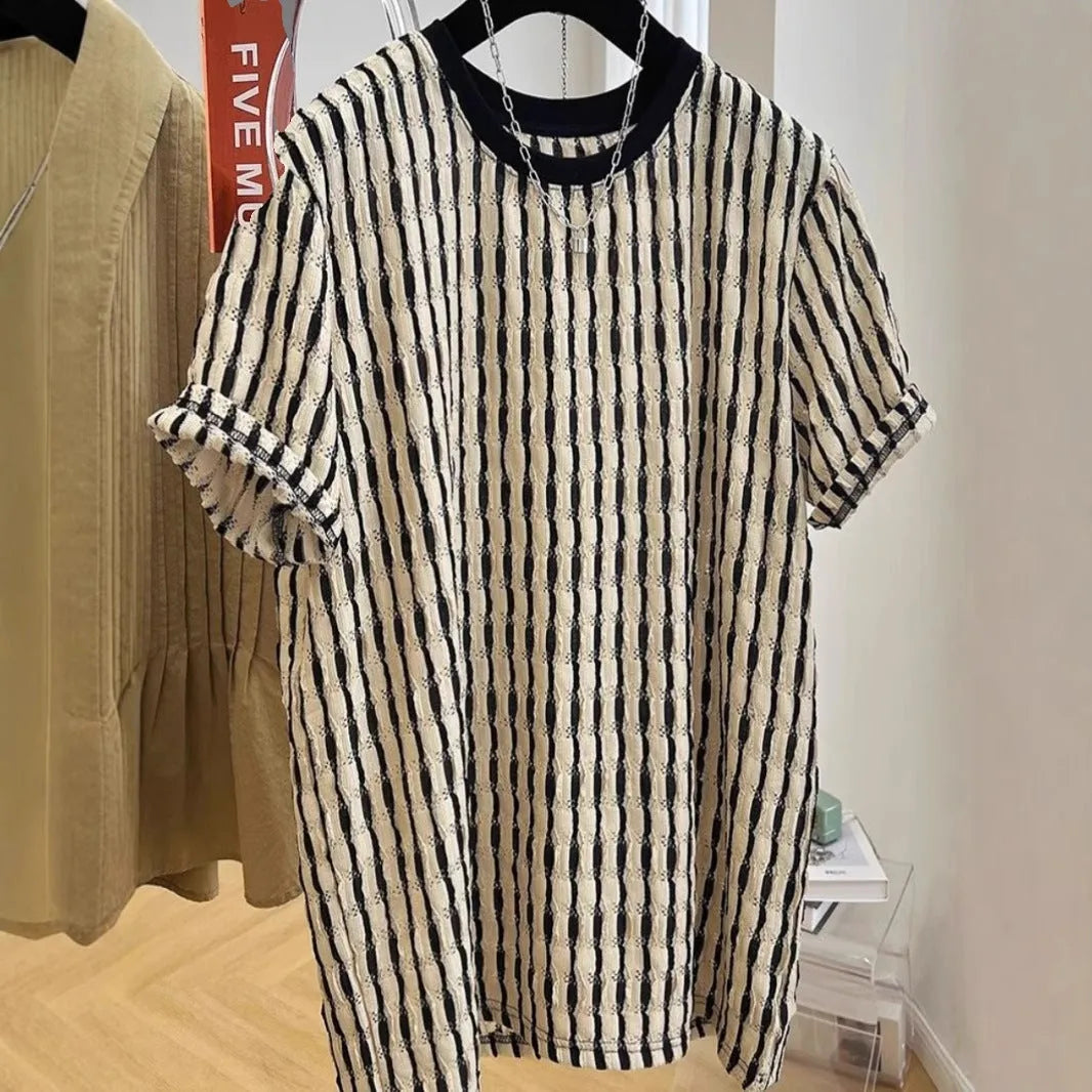 Men's black striped linen silk blend short sleeve shirt laid flat showing loose casual fit