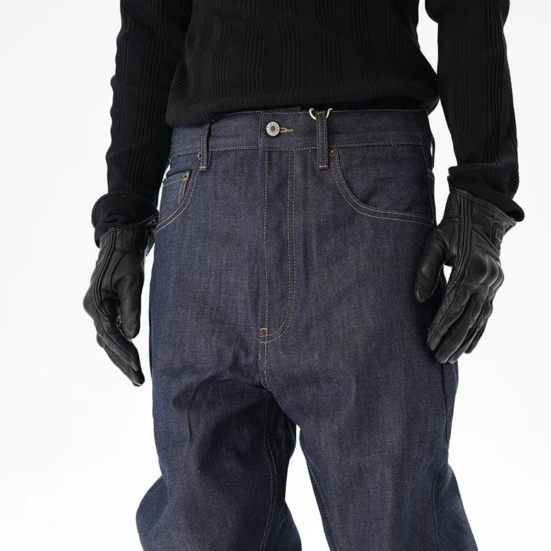 Man wearing dark blue loose fit straight leg denim jeans.