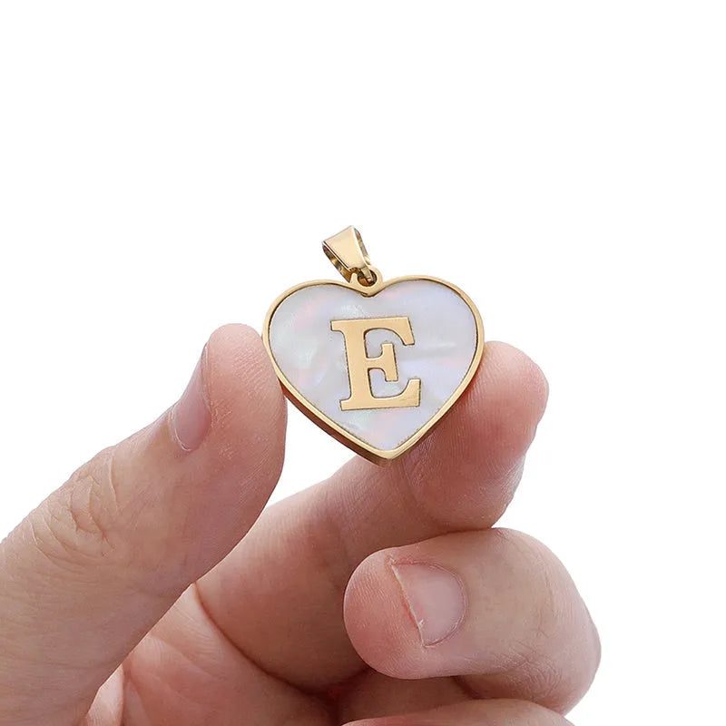 Gold-plated heart necklace with white shell centre and personalised letter pendant on 45cm chain