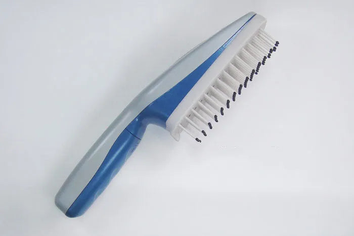 White pet ion comb with removable brush head and 78 comb teeth on a blue background.