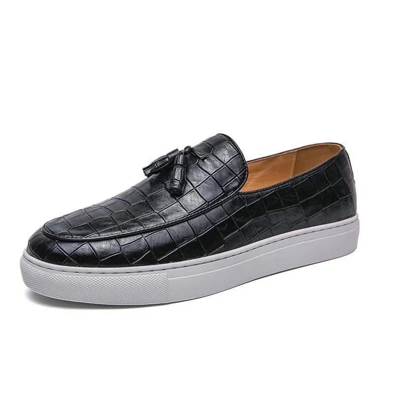 Men's brown tassel sneakers with round toe and rubber sole on a white background.