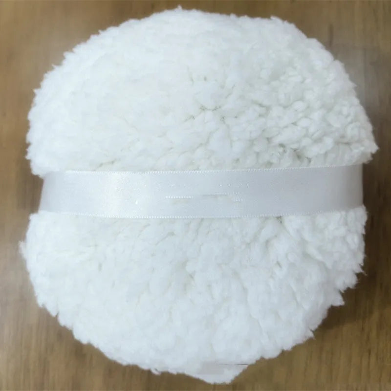 Large rectangular plush powder puff for makeup application in pink, white, or skin colour.