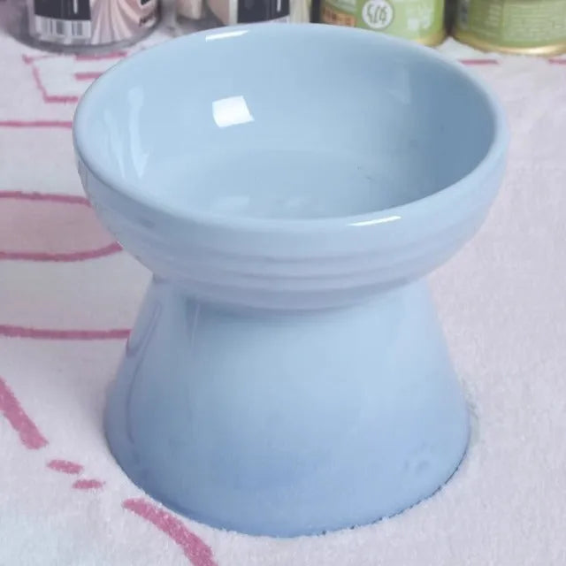 White ceramic pet bowl with a high foot neck and slanted rim for cat or dog feeding