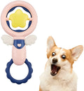 Four pink rubber dog toys including squeaky toys and dental chews for large breed dogs