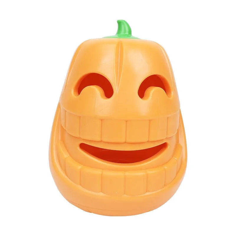 Orange Halloween pumpkin shaped dog chew toy with treat dispensing openings