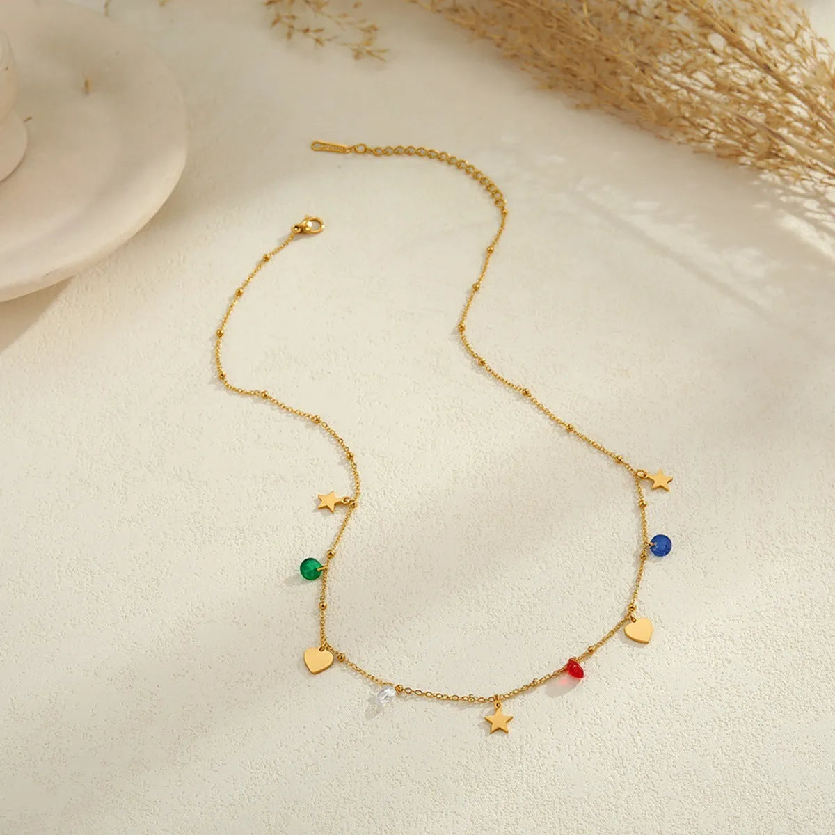 Stainless steel zircon necklace clavicle chain with beaded blue bracelet set geometric pendant on white background