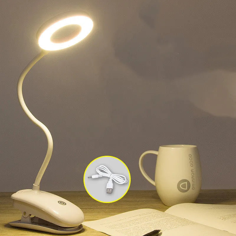 White rechargeable clip-on desk lamp with a modern plastic shade and touch switch