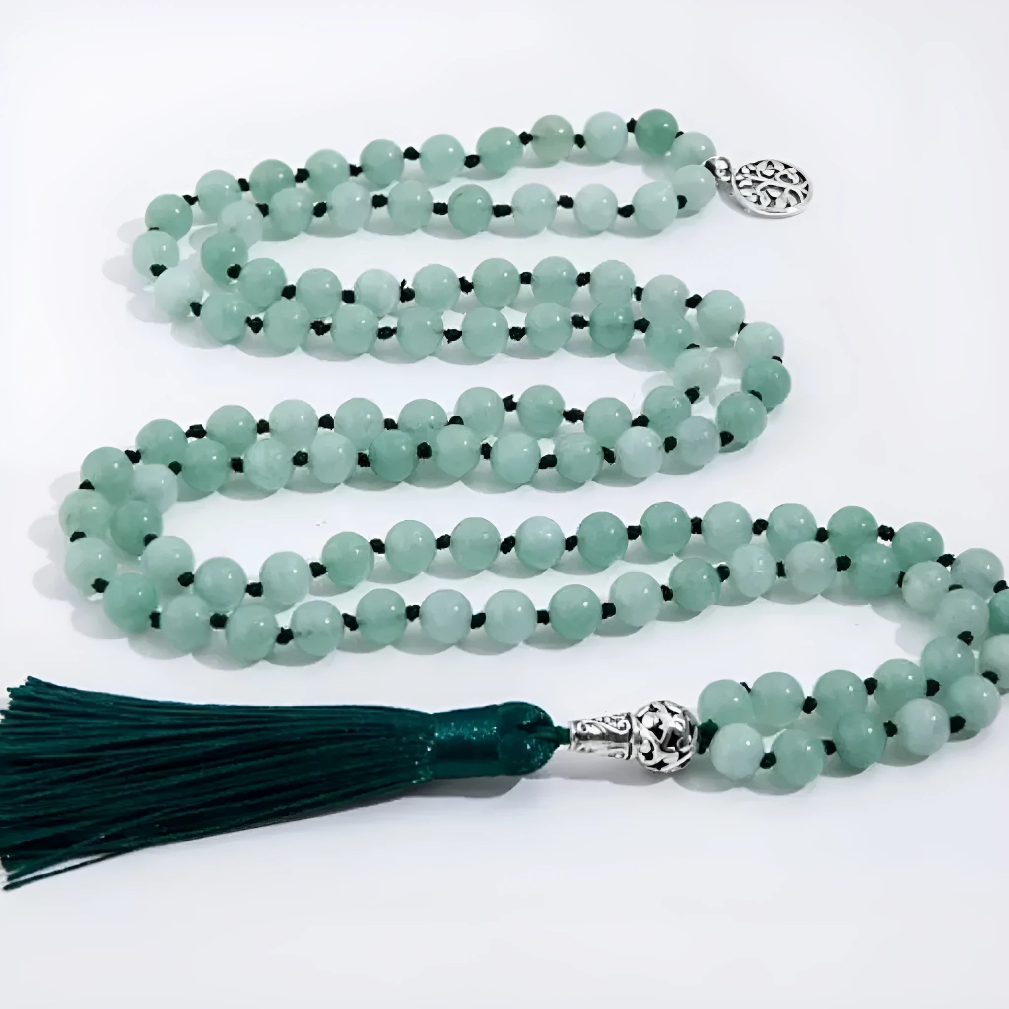 Handmade knotted stone bead necklace with 108 beads, showing geometric design and natural stone colours.