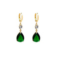 A pair of emerald green geometric teardrop alloy earrings on a plain background.