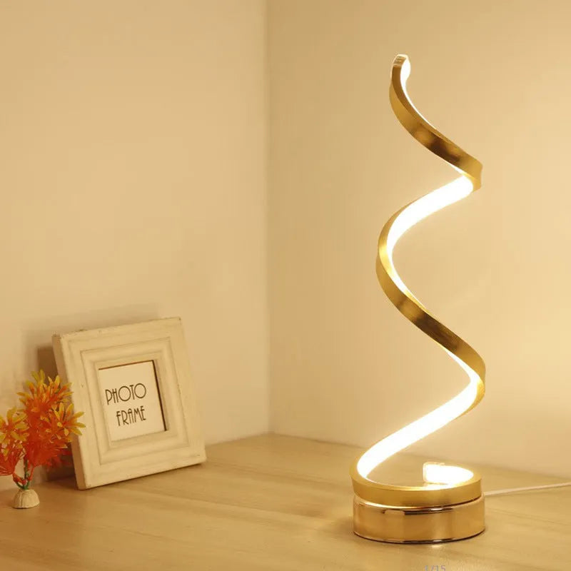 Minimalist black aluminium LED bedside table lamp on nightstand