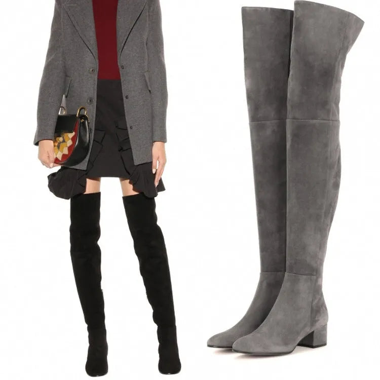 Grey suede women's flat over the knee boots with a pointed toe and thick low heel.