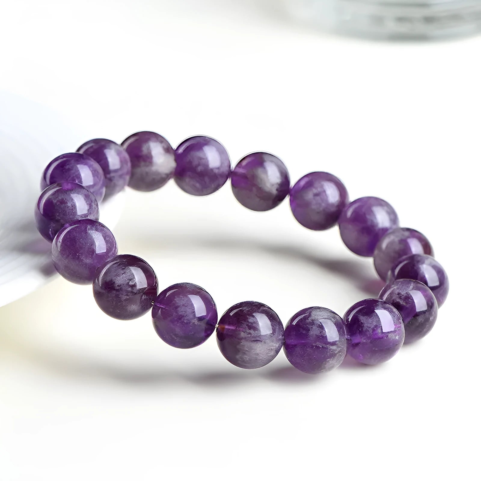 Natural feather amethyst crystal bracelet in snow mountain purple colour with scattered beads.