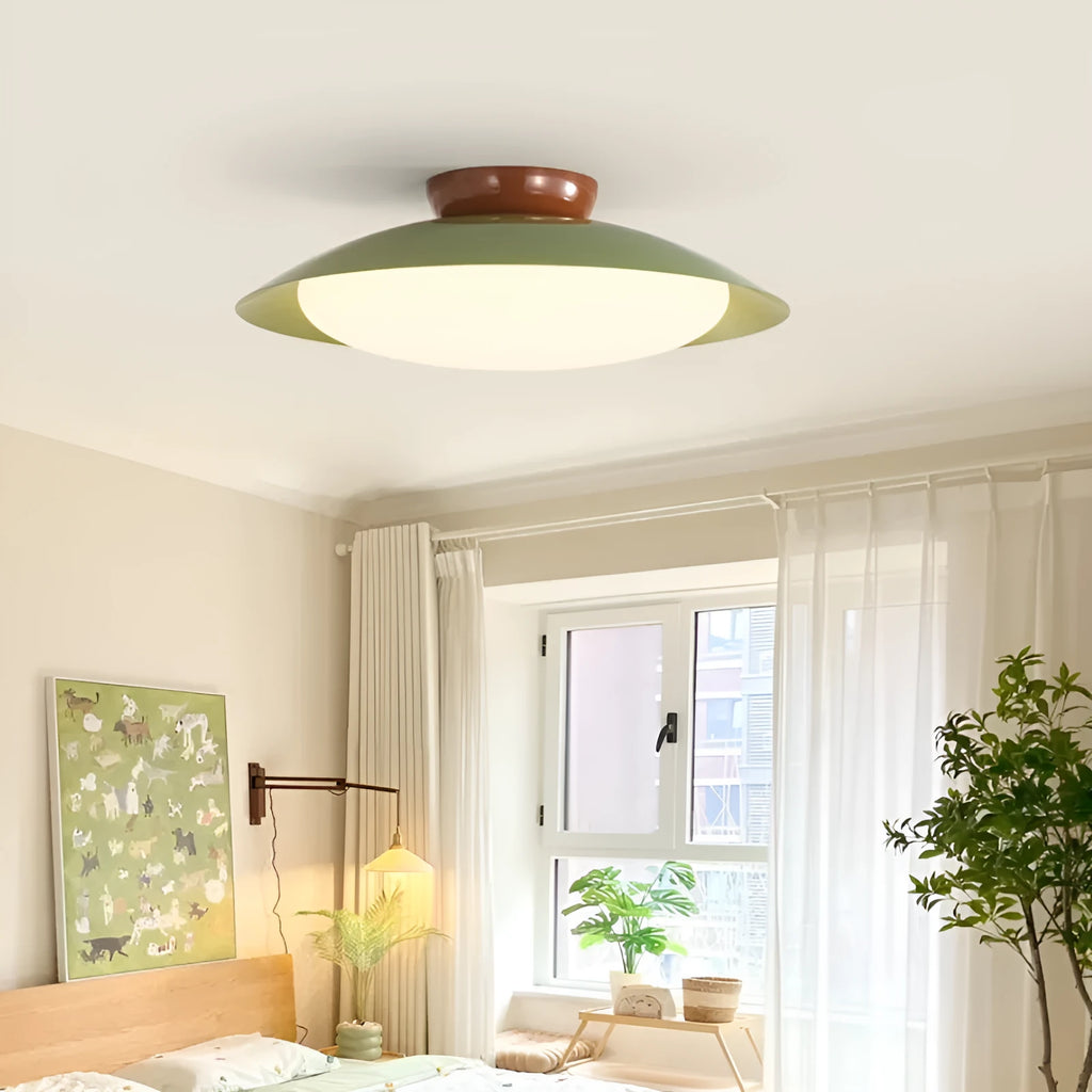 Modern cream style flying saucer shaped ceiling lamp in an iron shade.