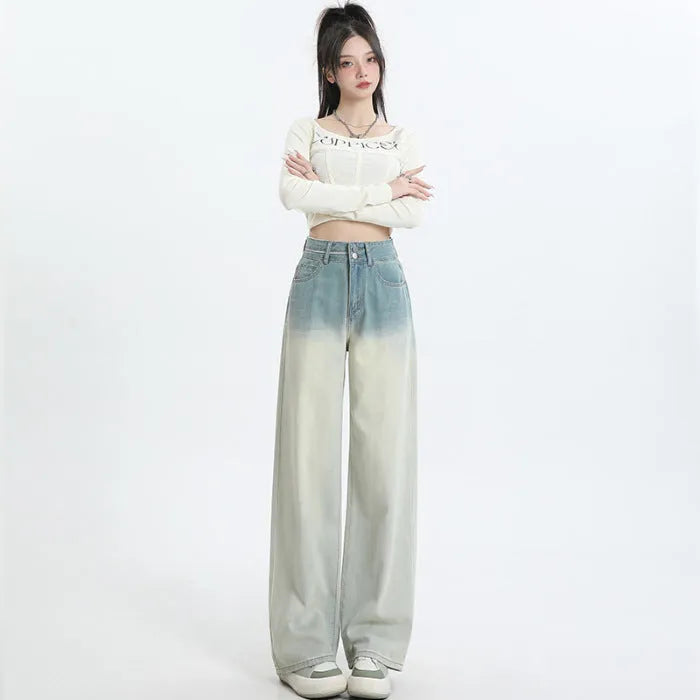 Women's gradient blue wide leg straight-leg denim trousers laid flat.
