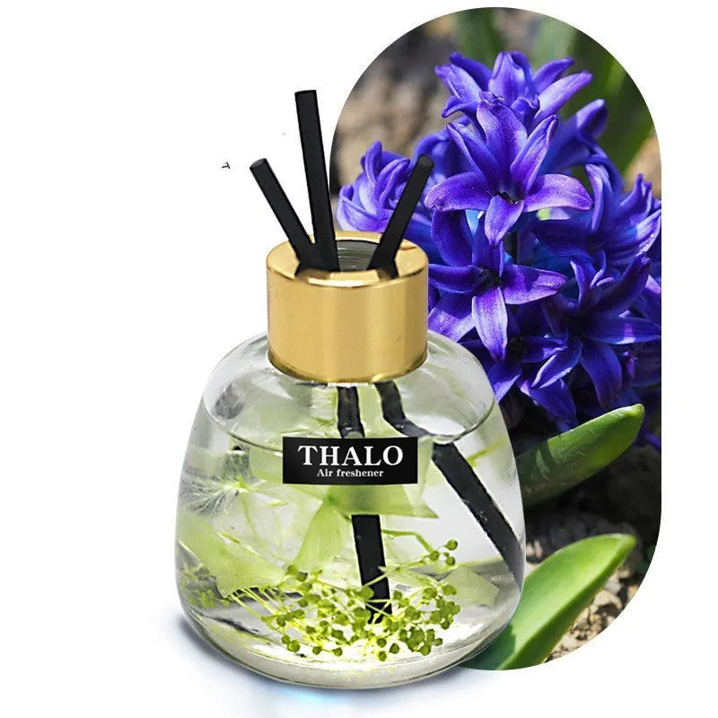 Glass bottle car perfume ornament with loose incense in decorative colours.
