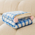 Blue coral fleece pet blanket for a dog, shown on a sofa, with size options S, M, L, XL.