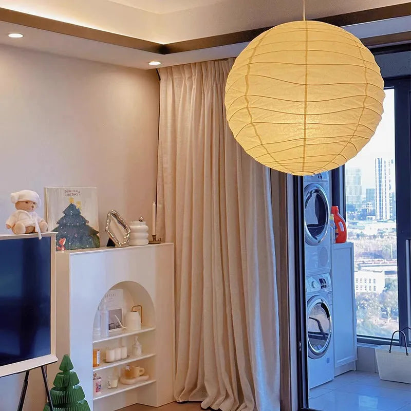 Japanese-style rice paper ball chandelier pendant light in a living room setting.