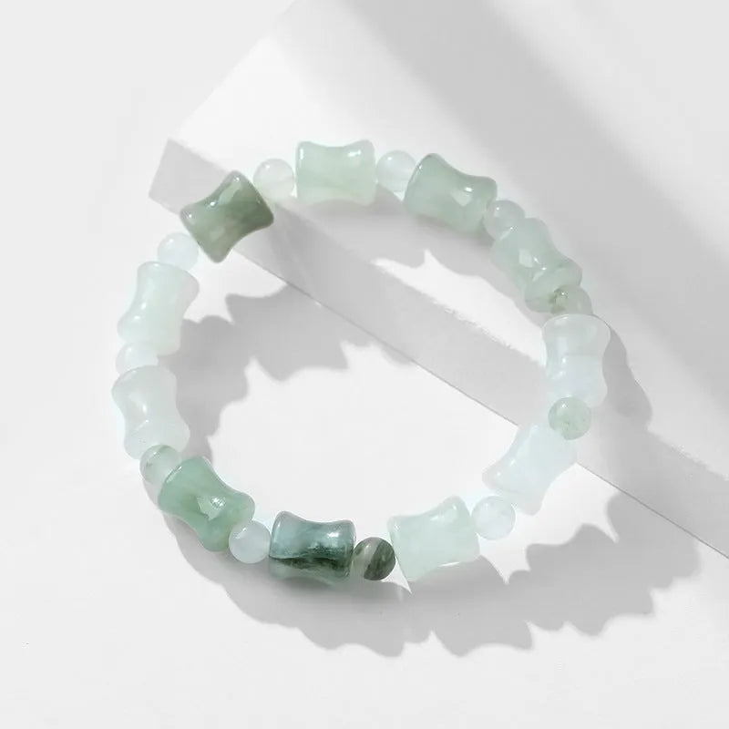 Natural chalcedony jade and coconut shell bead bracelet with diamond shapes and a safety lock clasp.