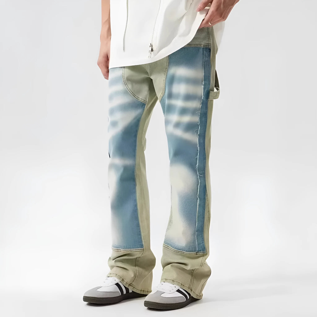 Yellow and blue retro patchwork jeans with splash-ink distressed design and zip fly.