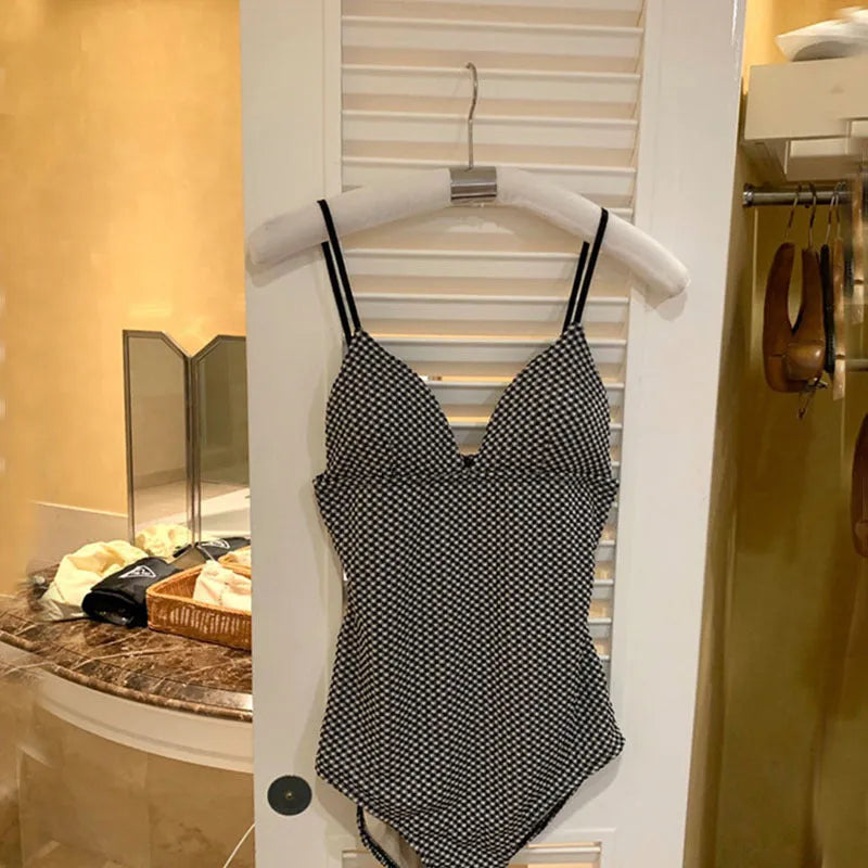 Blue or black one-piece swimsuit for belly and chest coverage, made of thin polyester fabric
