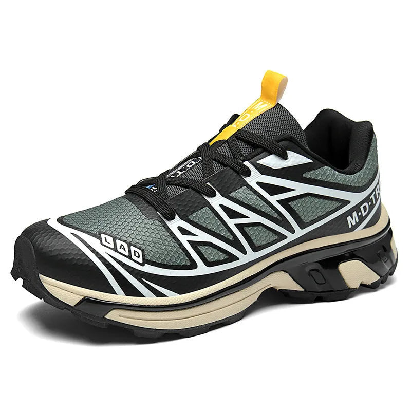 Pair of low-top hiking shoes in artificial leather with a mesh lining and rubber sole.