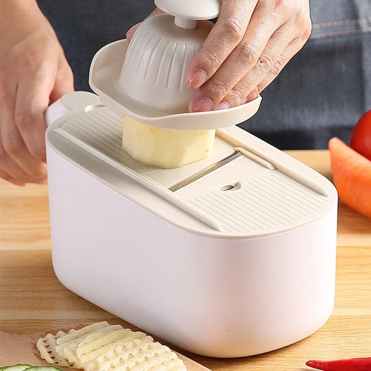 Nordic style manual vegetable slicer with stainless steel blades in blue, grey, and khaki colour options.