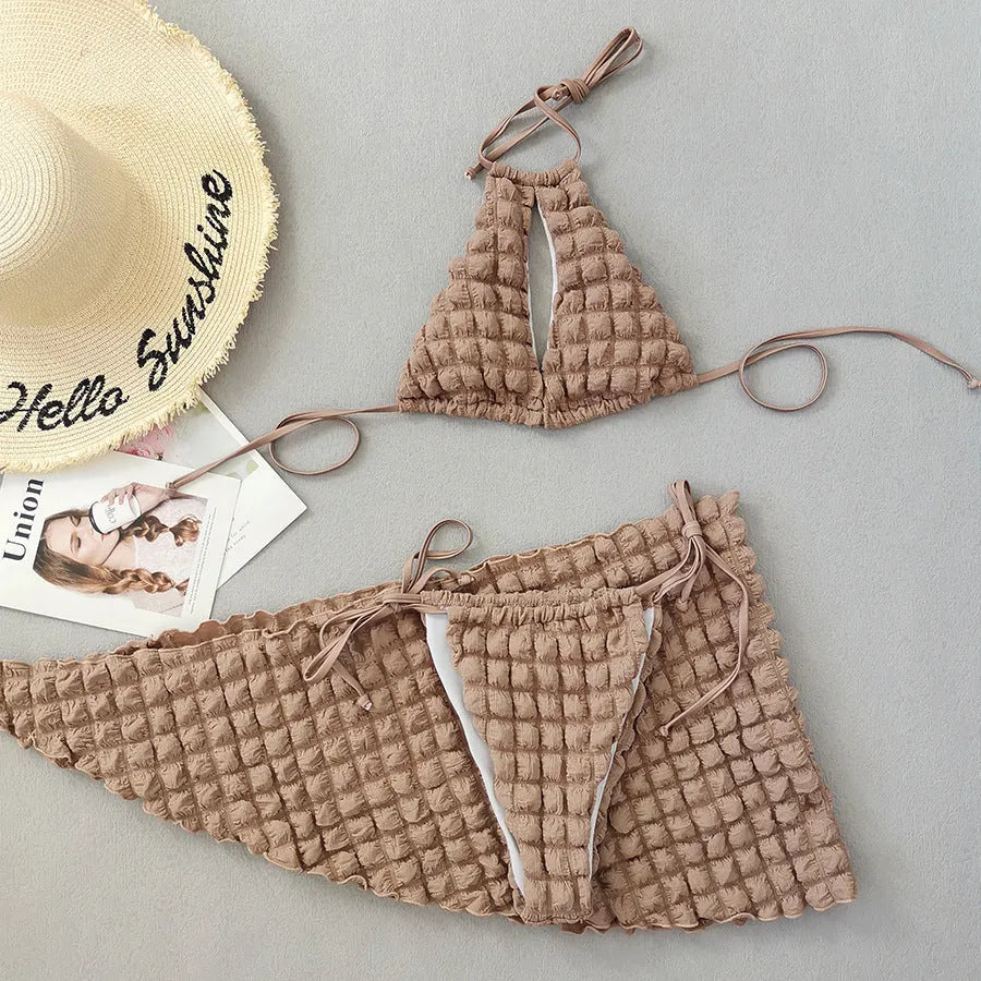Brown seersucker three-piece women's bikini swimsuit with lace-up design on mannequin