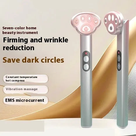 Gradient pink cat's paw shaped eye massager with micro-current technology and charging cable