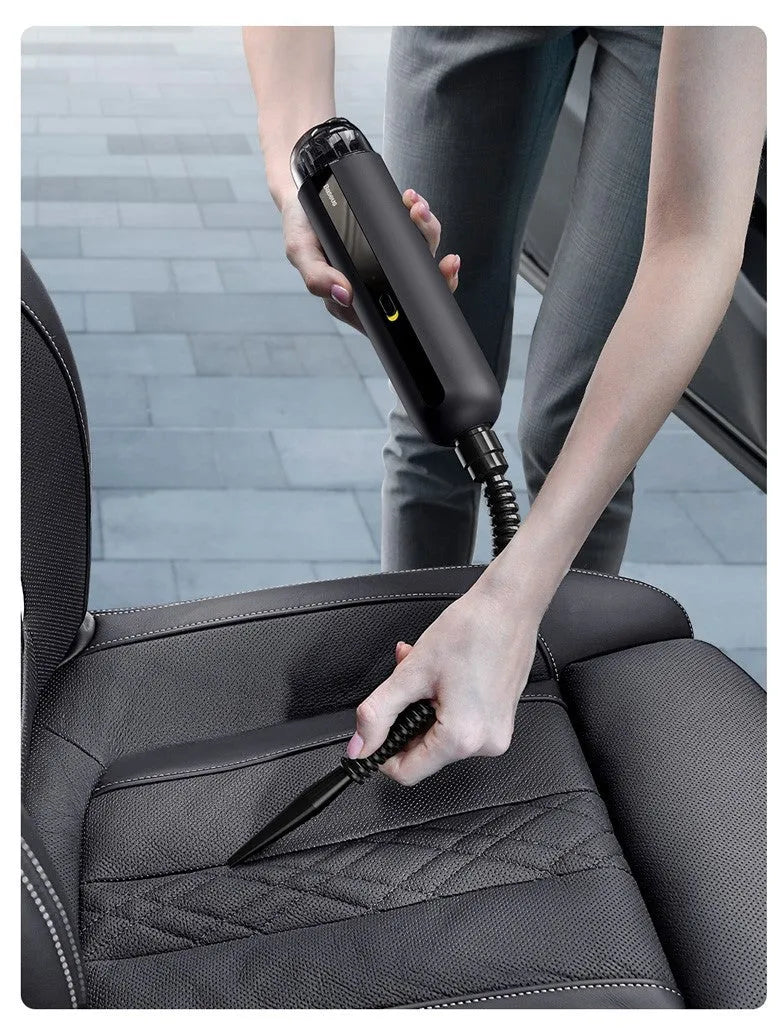 Baseus wireless handheld car vacuum cleaner in black, shown with blowing hose attachment and Type-C charging cable.