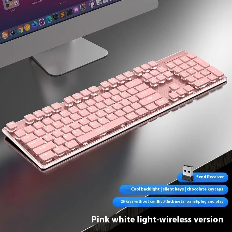 Wireless Bluetooth and 2.4G keyboard in Cherry Blossom Pink colour on a desk next to a tablet.