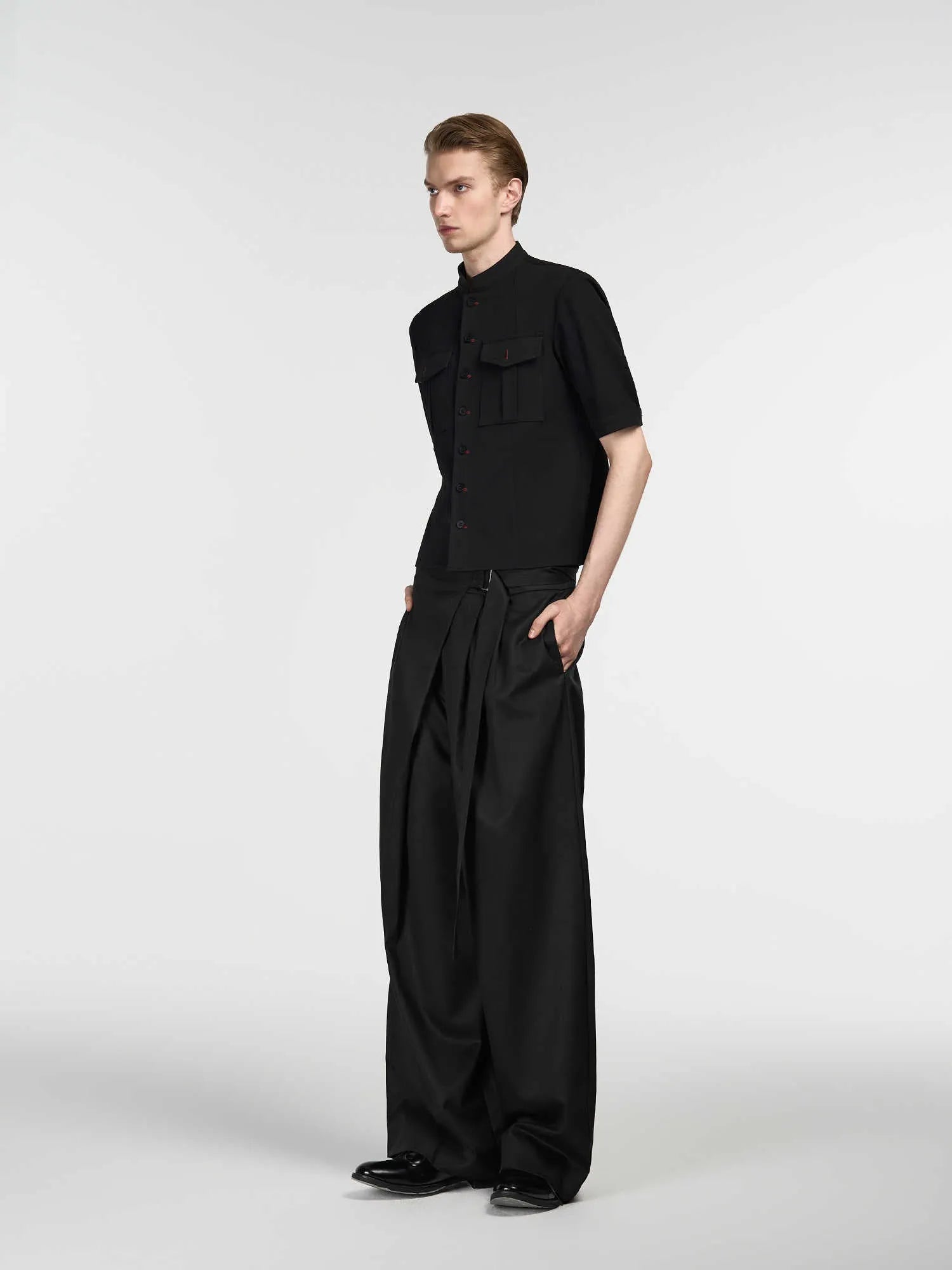 Black straight-leg trousers with adjustable waistband and single pleated front detail