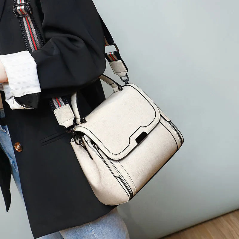 Genuine leather women's vintage messenger bag with multiple internal compartments in caramel colour