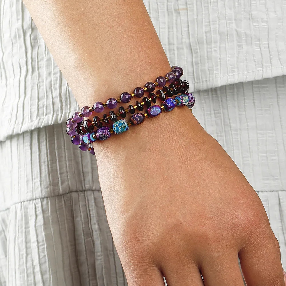 Purple amethyst and garnet stone bracelet with geometric beads and texture details