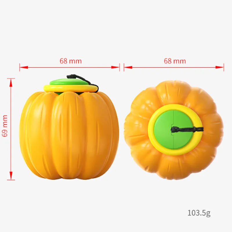 Small orange plastic pumpkin dog ball with squeaker for puppy chewing and training