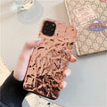 Rose Gold and Silver electroplated TPU folded back cover case for iPhone on a table
