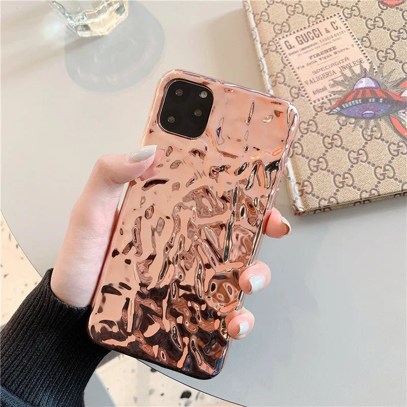 Rose Gold and Silver electroplated TPU folded back cover case for iPhone on a table