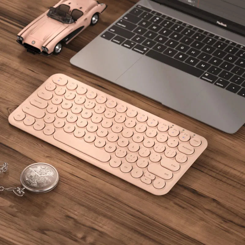 Mute white ultra-thin wireless keyboard and mouse with tiny USB receiver on a wooden desk