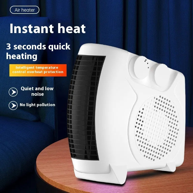 Compact white electric desktop heater with power settings, shown on a desk.